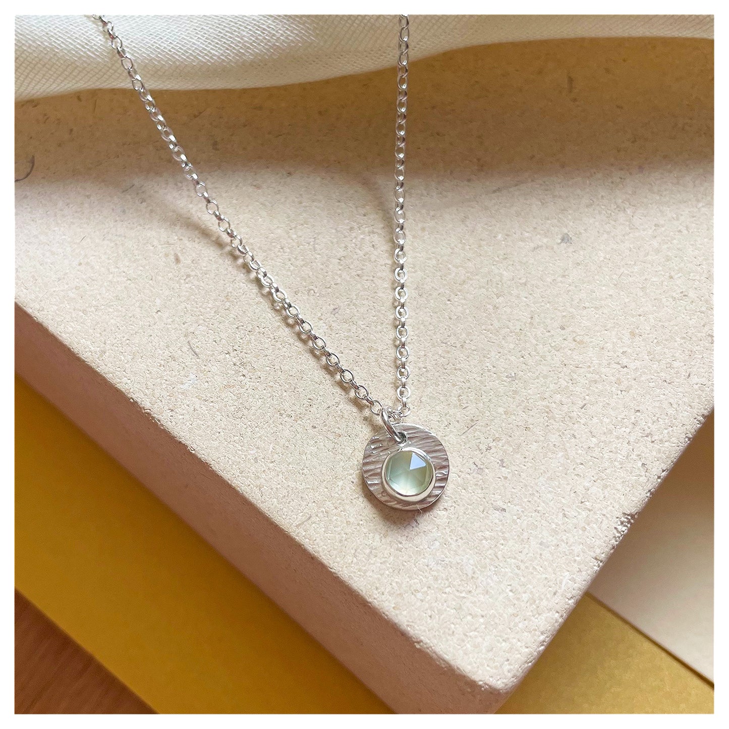 Sterling Silver and Prehnite Hammered Disc Pendant.
