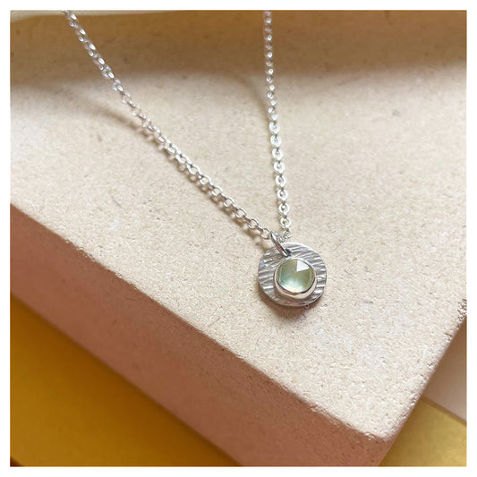 Sterling Silver and Prehnite Hammered Disc Pendant.