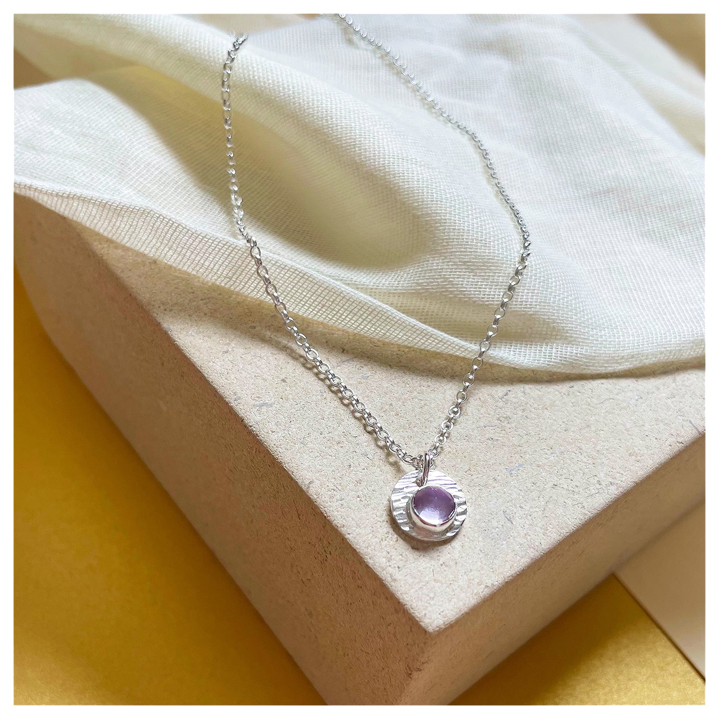 Sterling Silver and Brazilian Amethyst Hammered Disc Pendant.