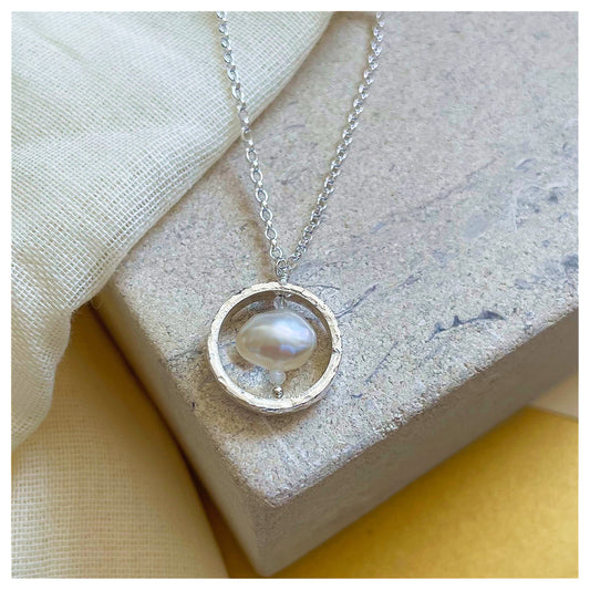 Sterling Silver Textured Circle Pendant Necklace with Freshwater Pearl and Moonstone.