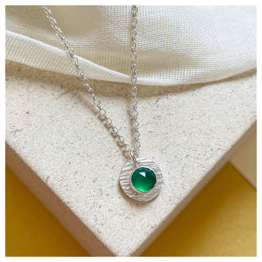 Sterling Silver and Green Onyx Hammered Disc Pendant.