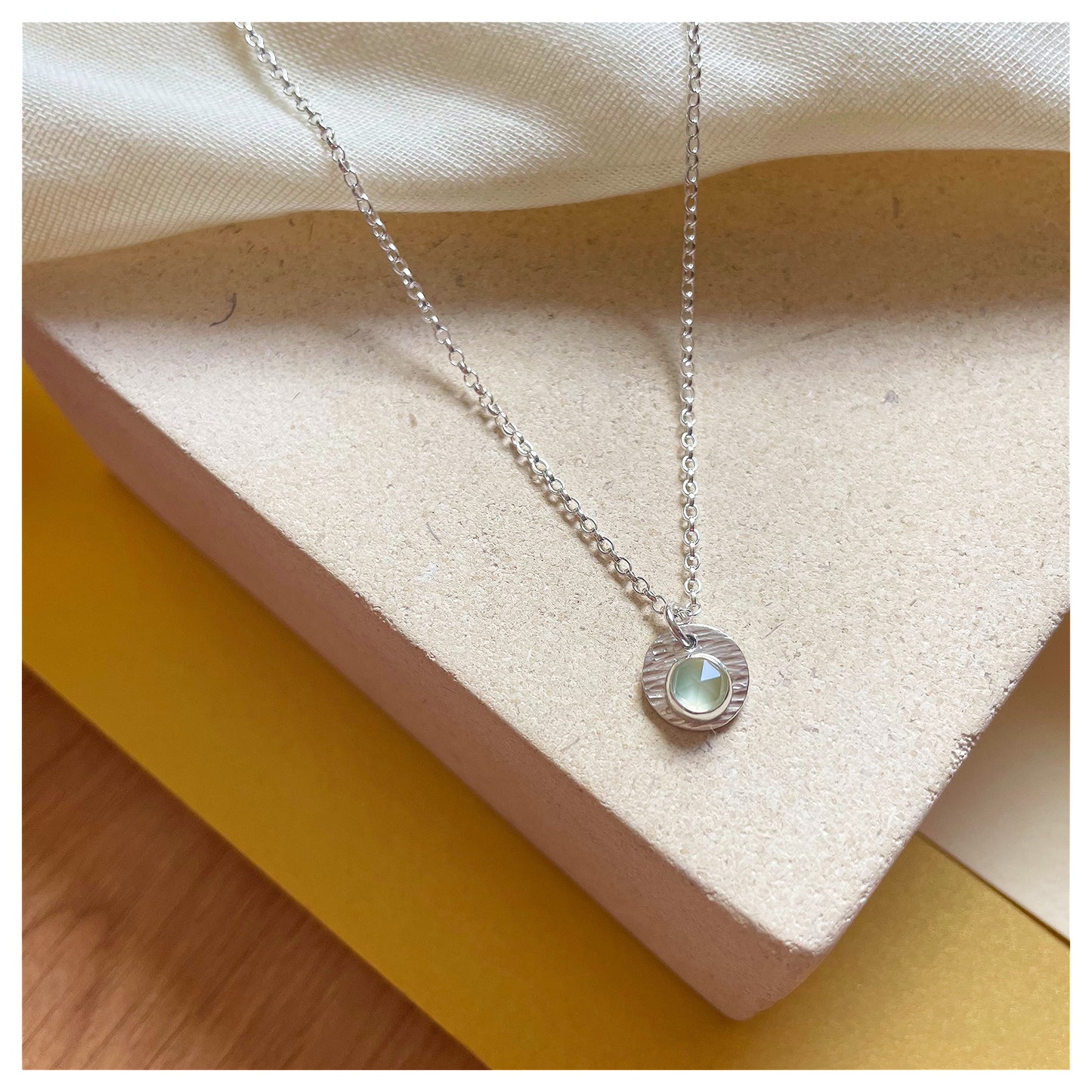 Sterling Silver and Prehnite Hammered Disc Pendant.
