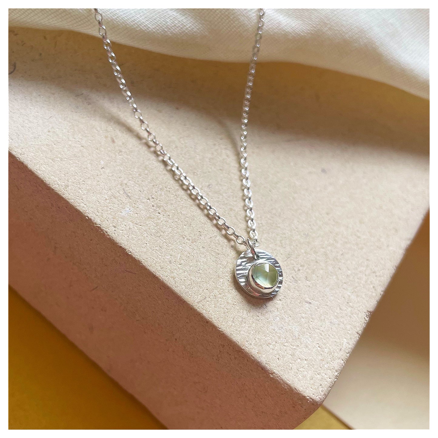 Sterling Silver and Prehnite Hammered Disc Pendant.
