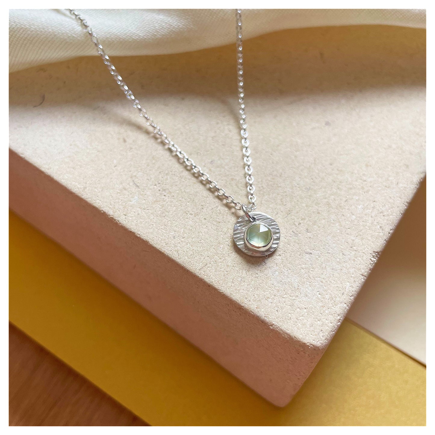Sterling Silver and Prehnite Hammered Disc Pendant.