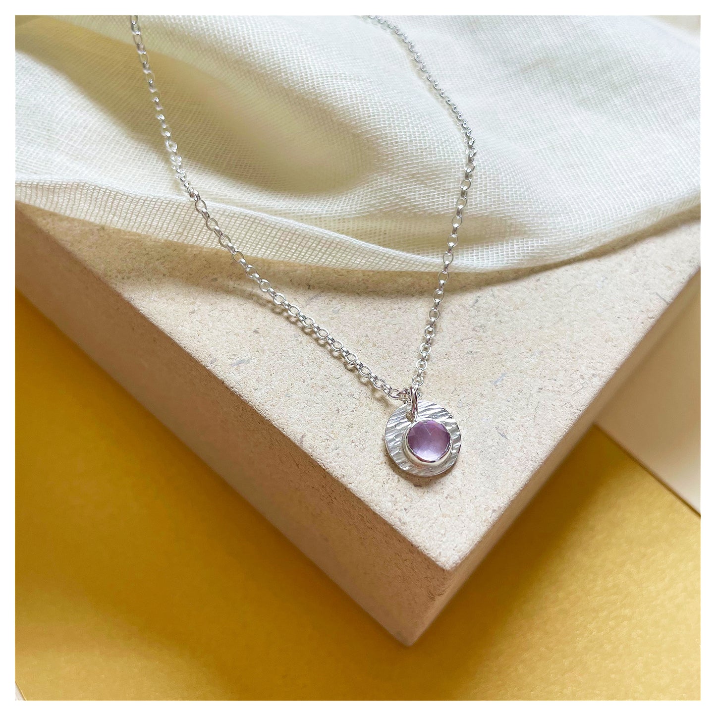Sterling Silver and Brazilian Amethyst Hammered Disc Pendant.