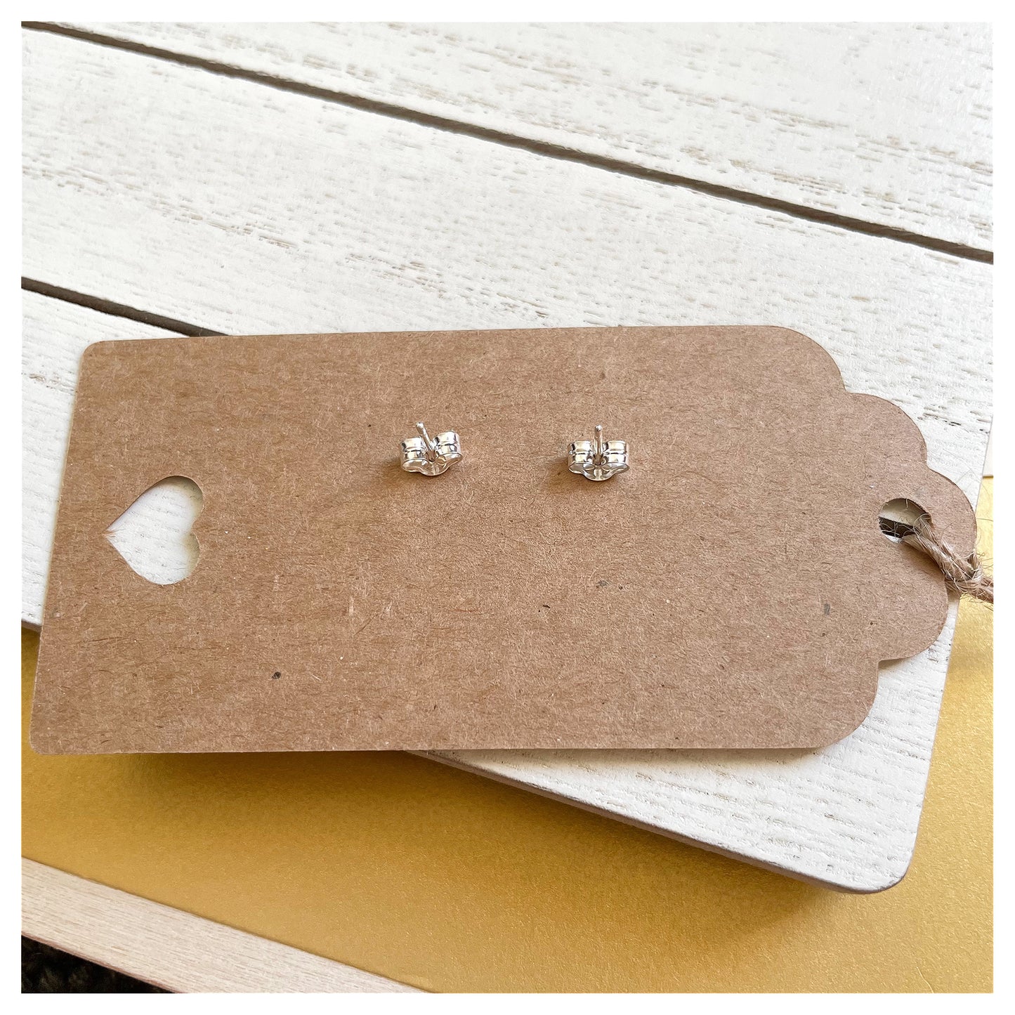 Medium Sterling Silver Hammered Hexagonal Stud Earrings.