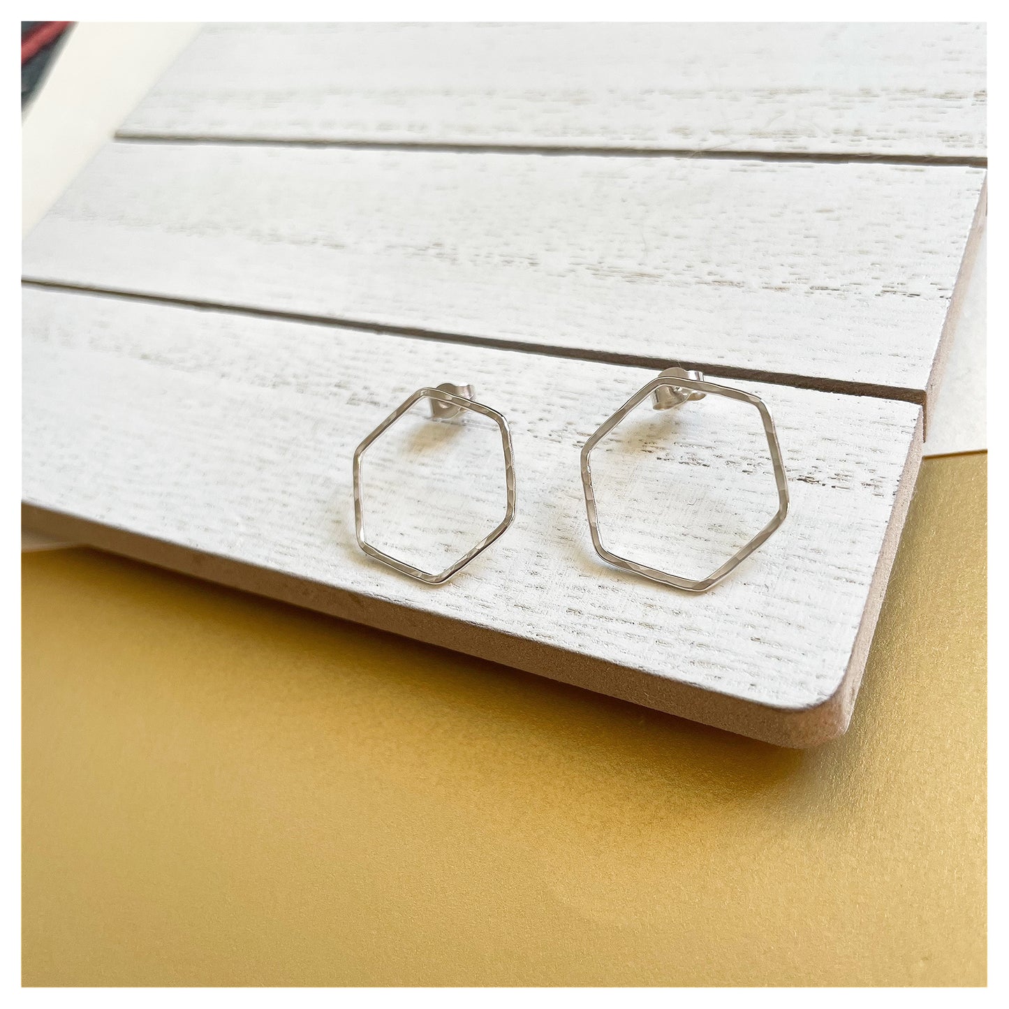 Medium Sterling Silver Hammered Hexagonal Stud Earrings.