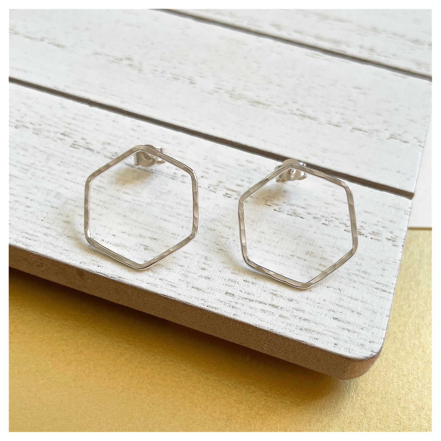 Medium Sterling Silver Hammered Hexagonal Stud Earrings.