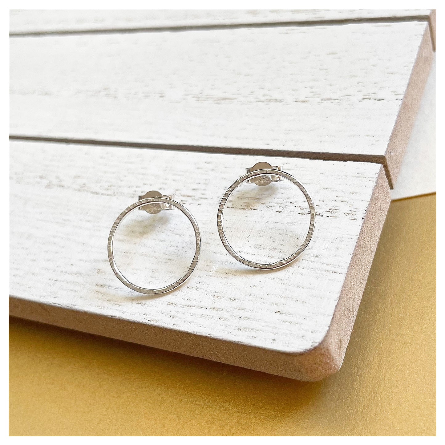 Small Sterling Silver Textured Circular Stud Earrings.