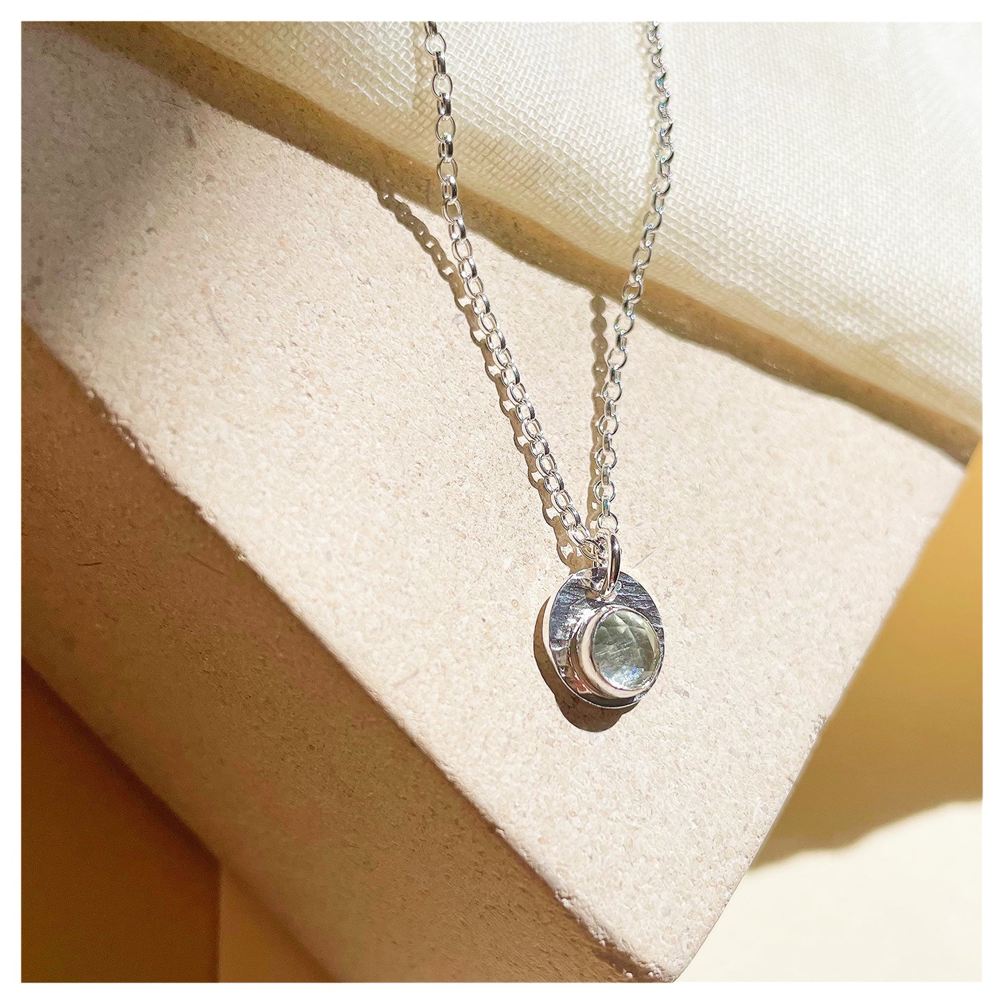 Sterling Silver and Green Amethyst Hammered Disc Pendant.