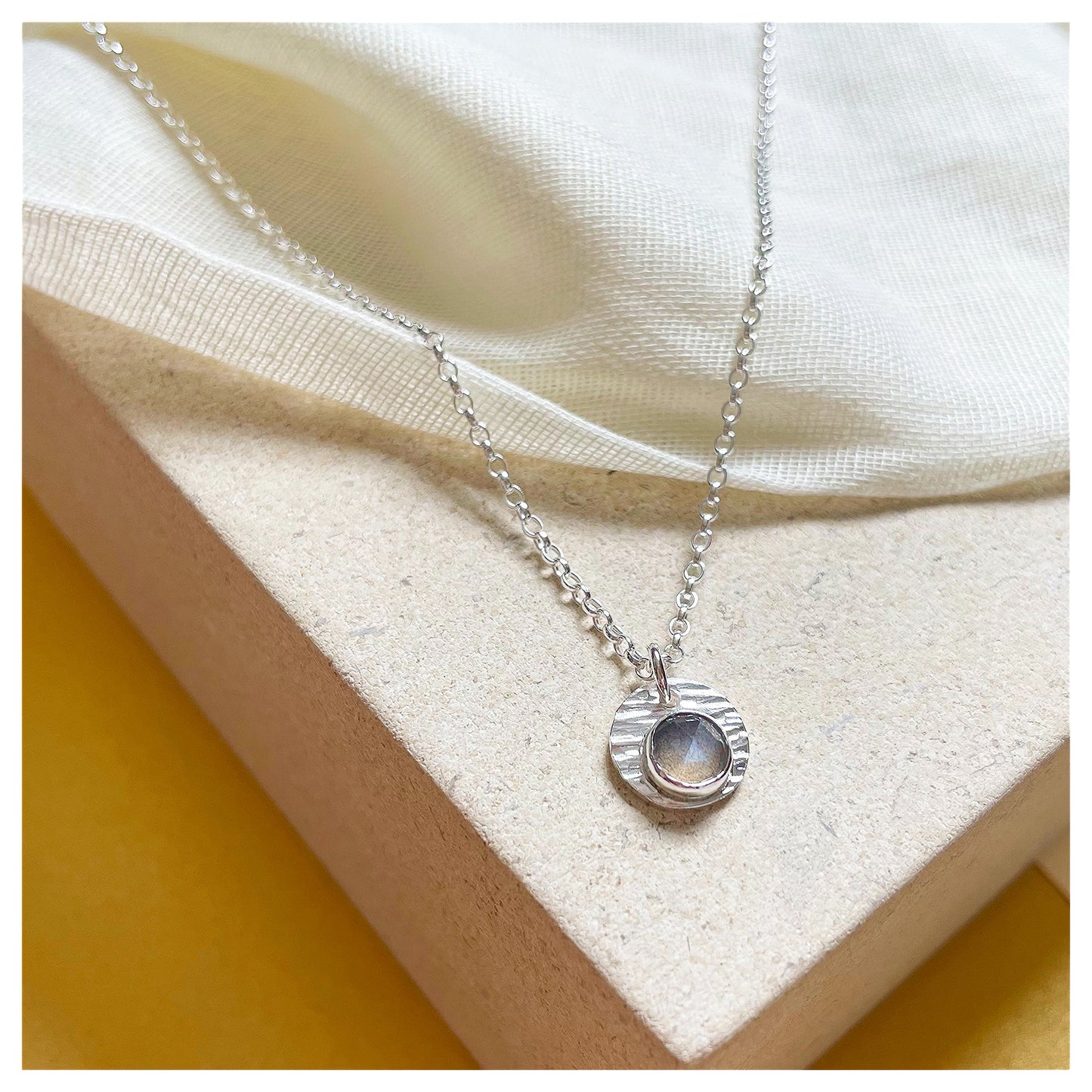Sterling Silver and Grey Moonstone Hammered Disc Pendant.