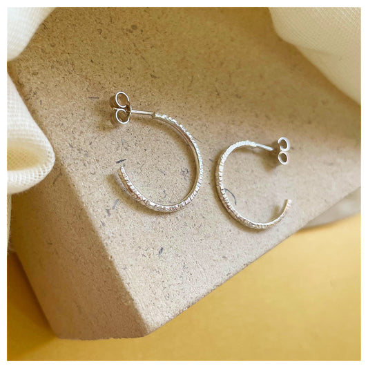 Sterling Silver Textured Hoop Earrings.