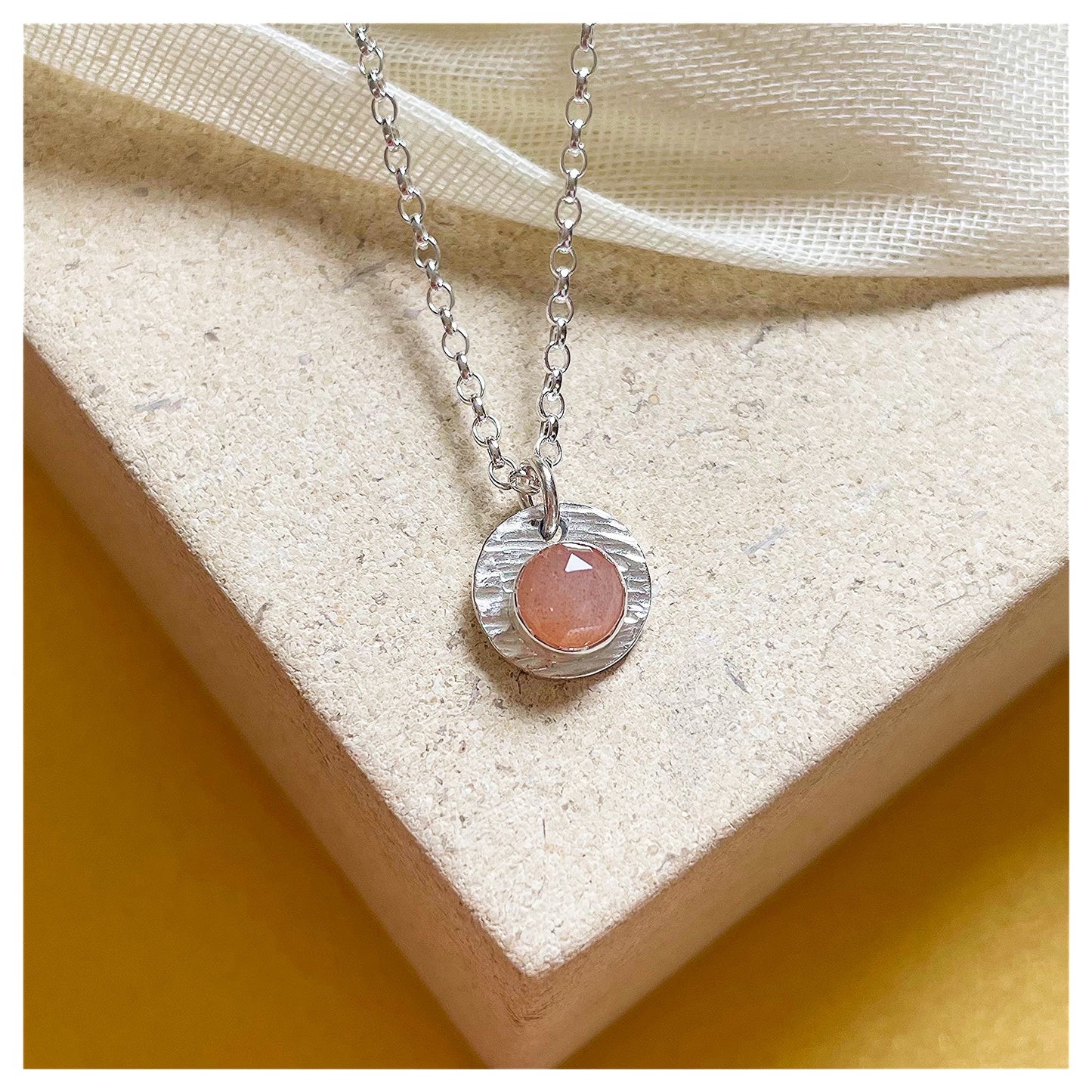 Sterling Silver and Peach Moonstone Hammered Disc Pendant.