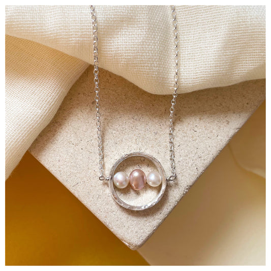 Sterling Silver Textured Circle Bar Pendant Necklace with Pink and White Freshwater Pearls.