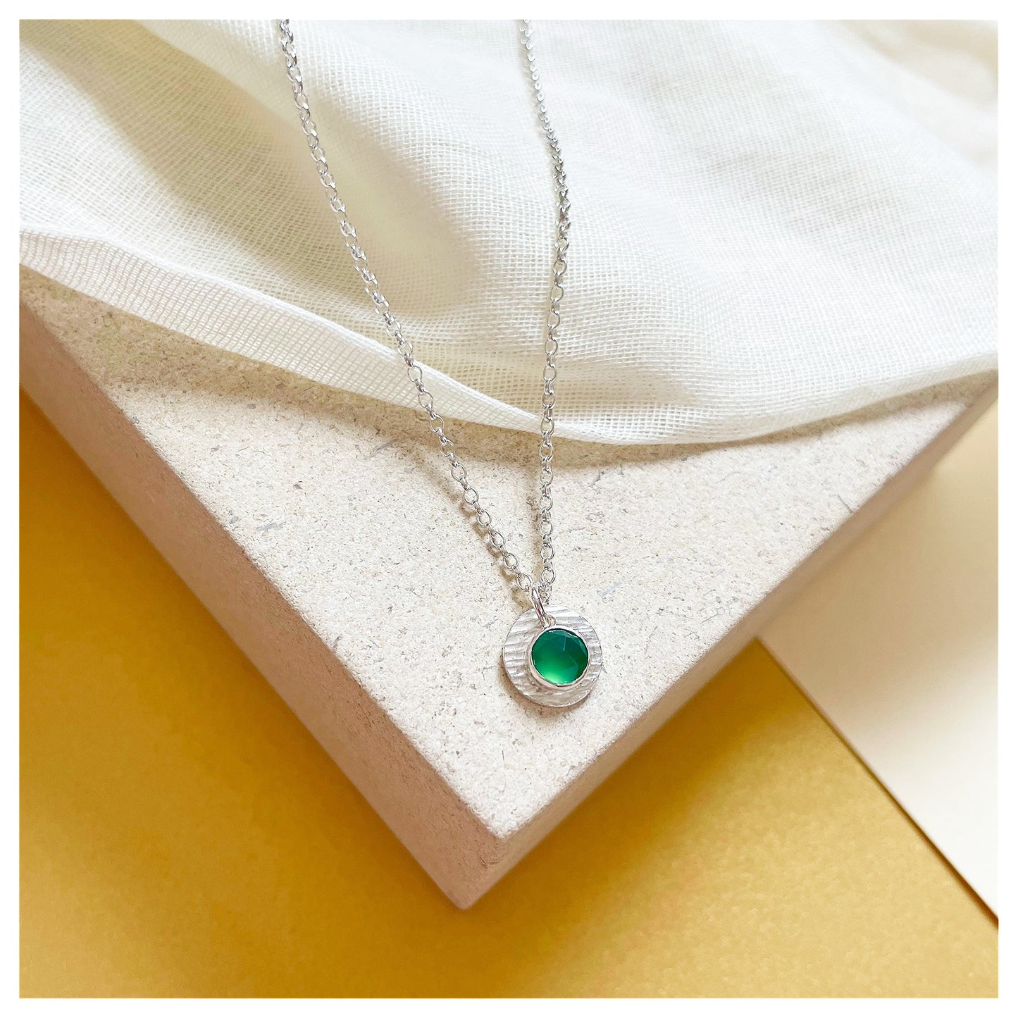 Sterling Silver and Green Onyx Hammered Disc Pendant.