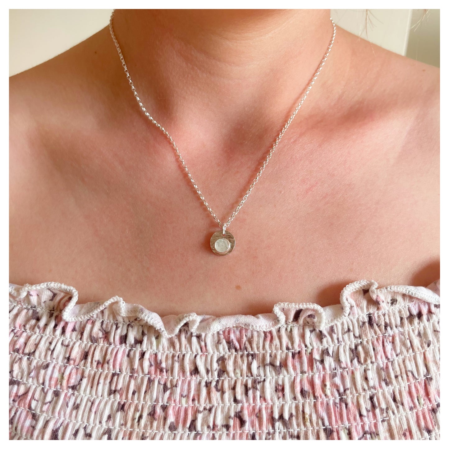Sterling Silver and White Opal Hammered Disc Pendant.