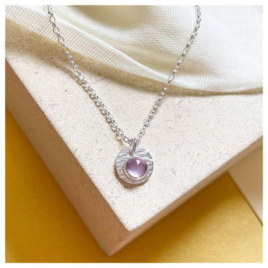 Sterling Silver and Brazilian Amethyst Hammered Disc Pendant.