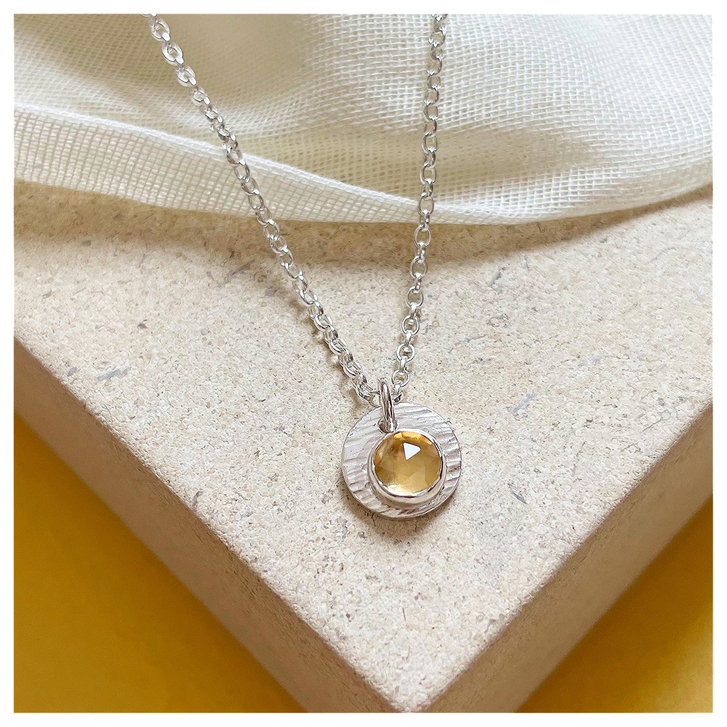 Sterling Silver and Citrine Hammered Disc Pendant.