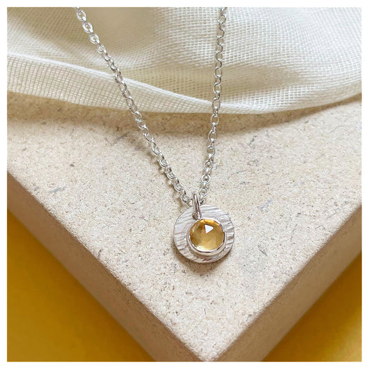 Sterling Silver and Citrine Hammered Disc Pendant.