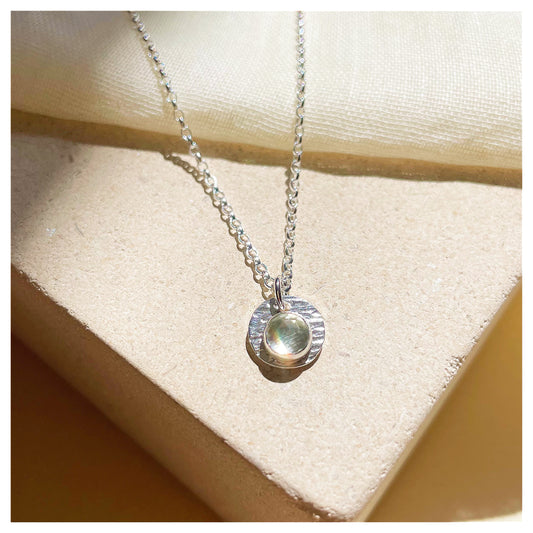 Sterling Silver and Green Amethyst Hammered Disc Pendant.