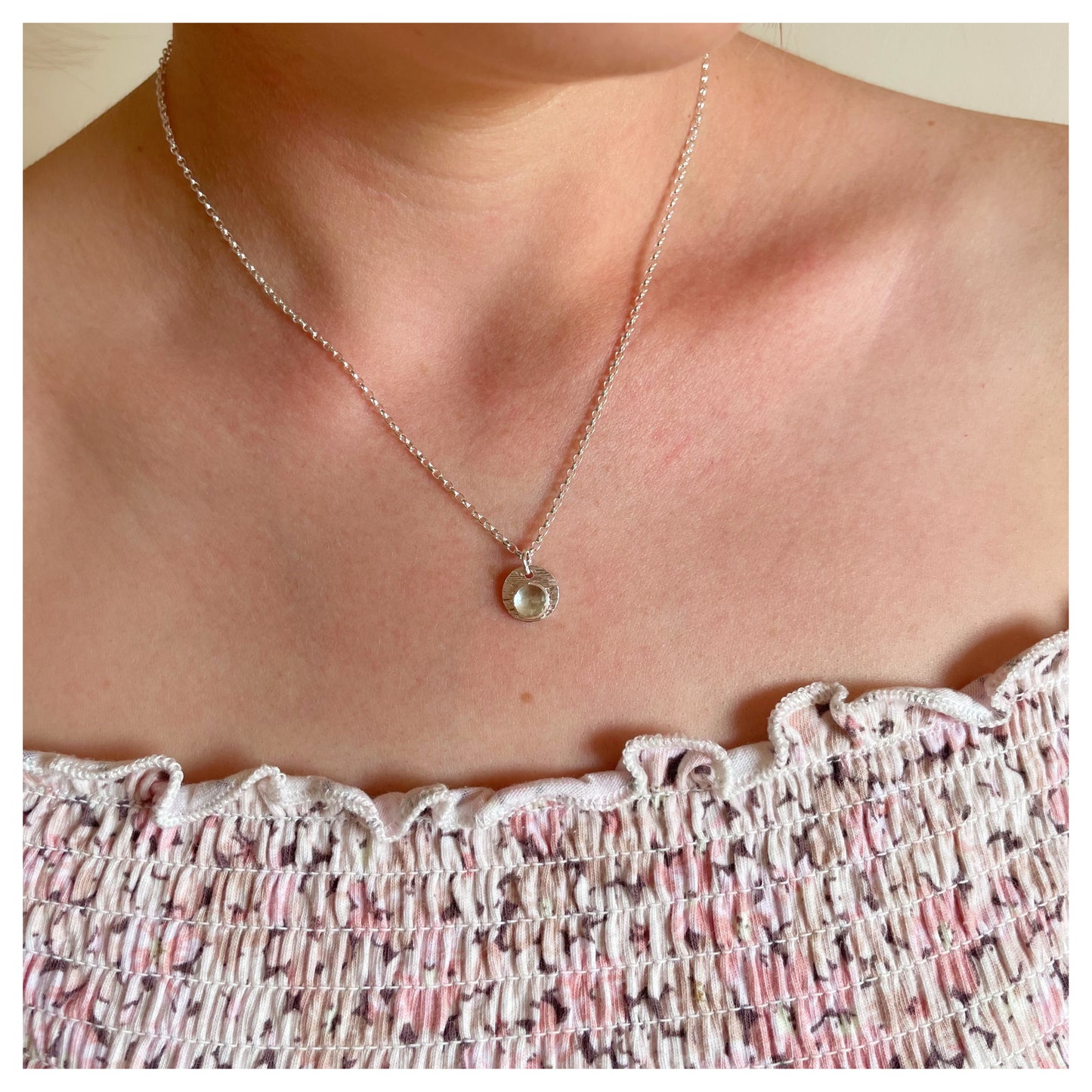 Sterling Silver and Green Amethyst Hammered Disc Pendant.