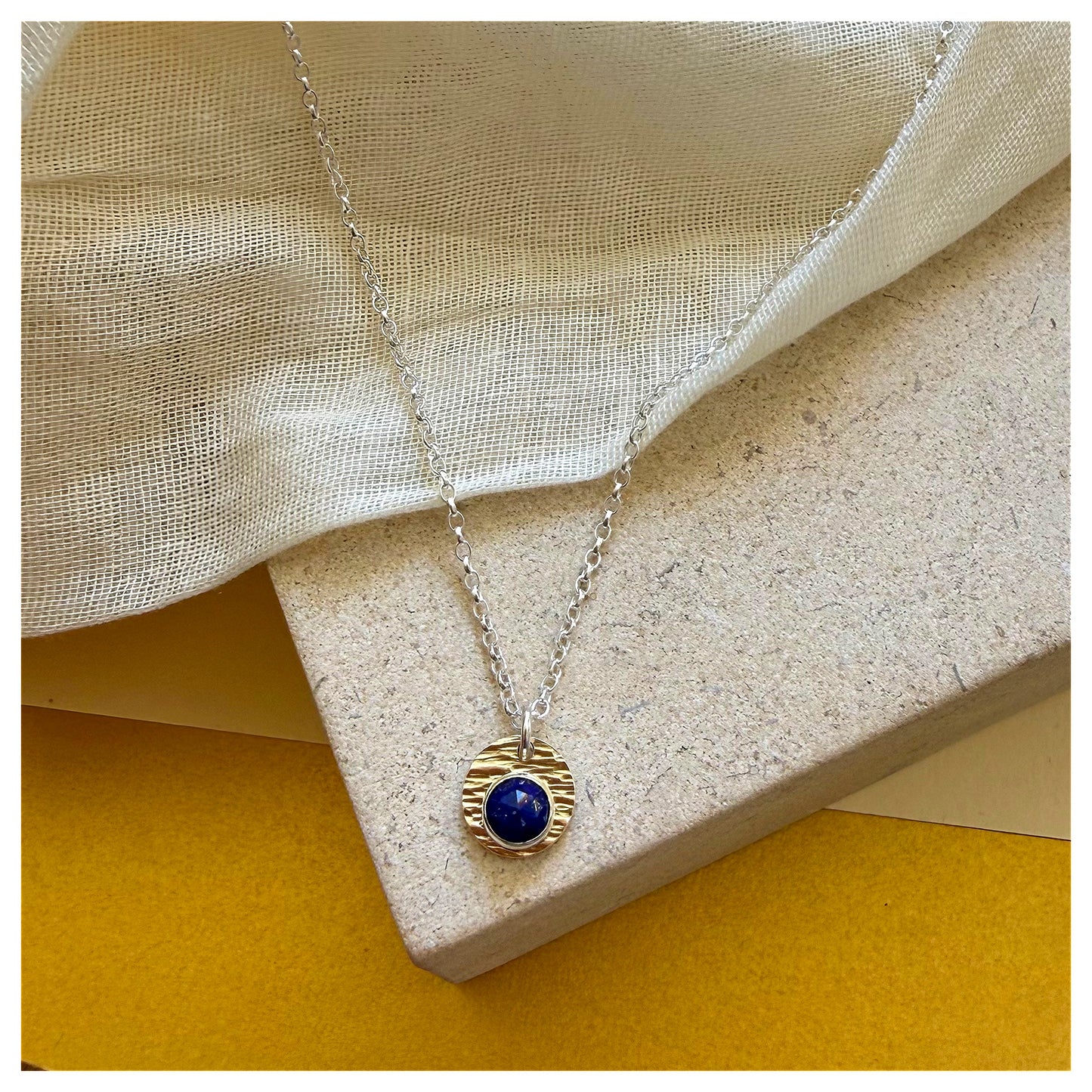 9ct Yellow Gold, Sterling Silver and Lapis Lazuli Hammered Disc Pendant.