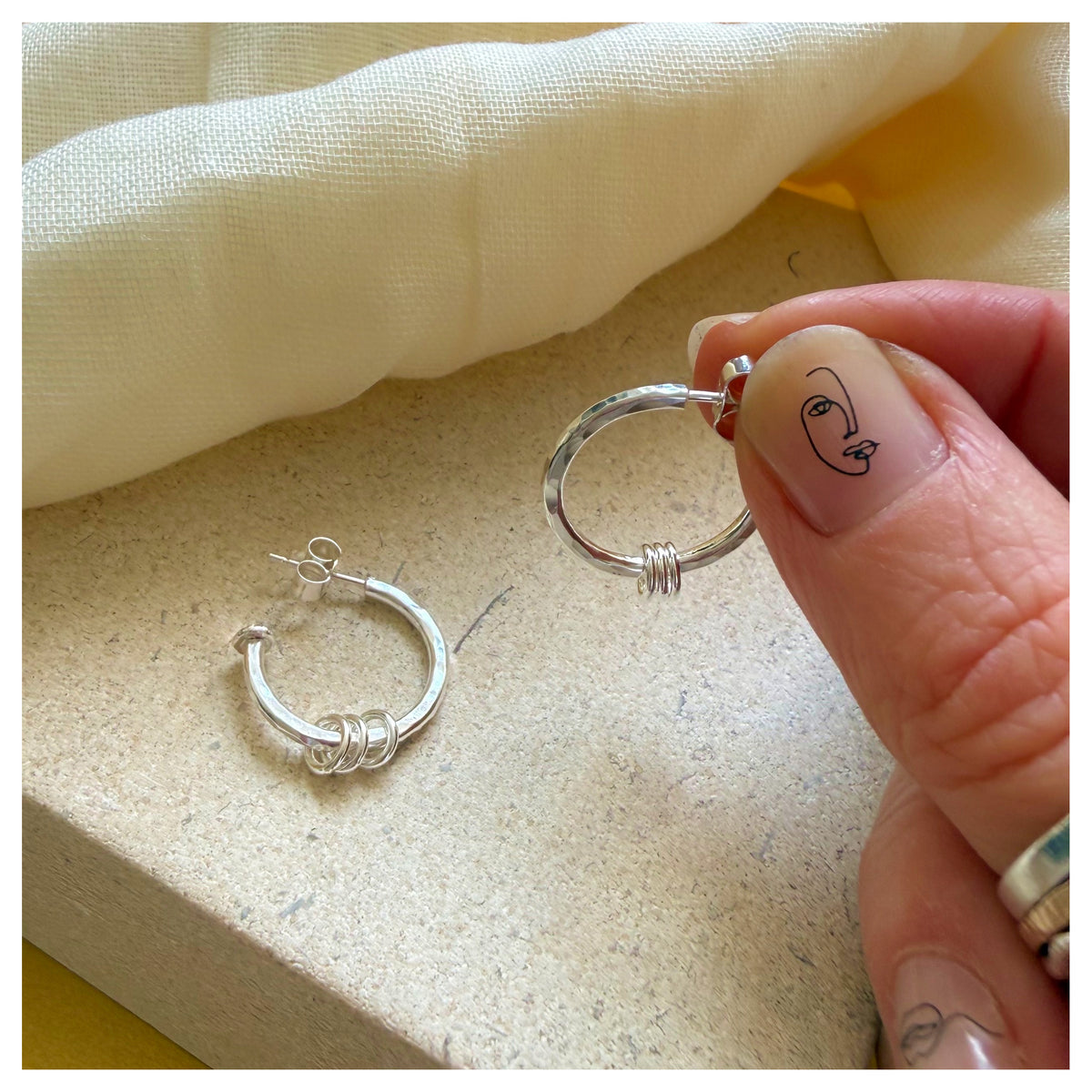 Sterling Silver 3/4 Hoop Earring With Triple Ring Detail.