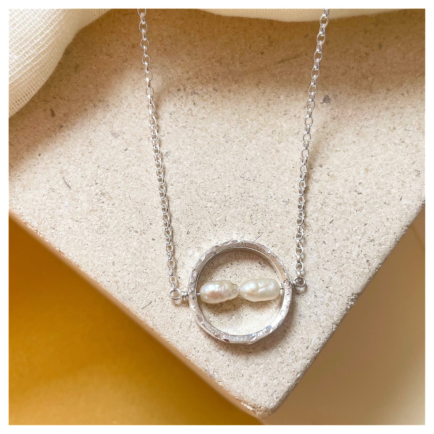 Sterling Silver Textured Circle Bar Pendant Necklace with Freshwater Rice Pearls.