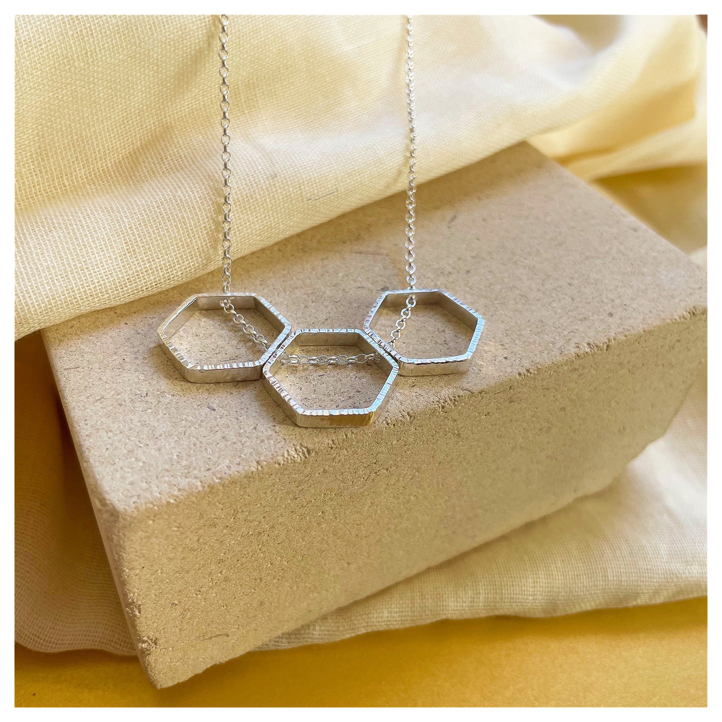 Sterling Silver Textured Triple Hexagon Necklace.