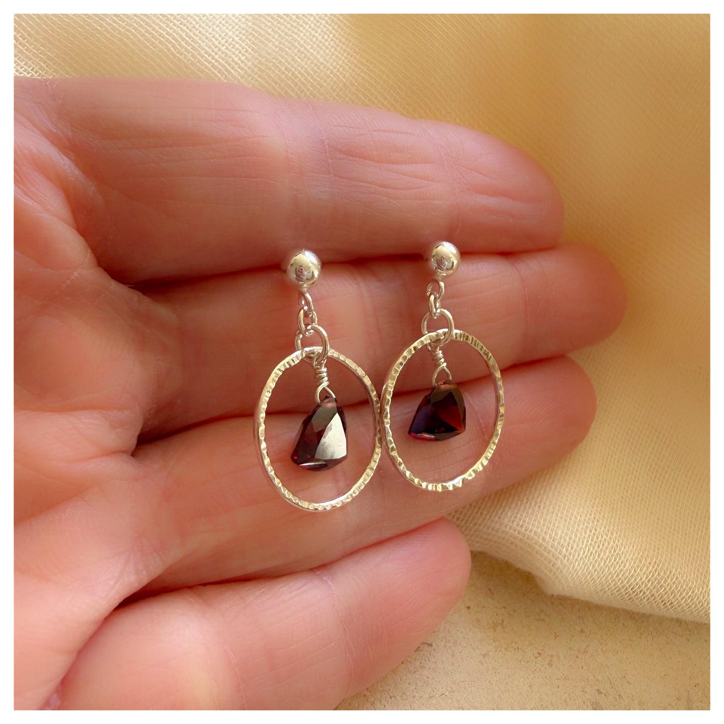 Sterling Silver Hammered Circle and Garnet Drop earrings.