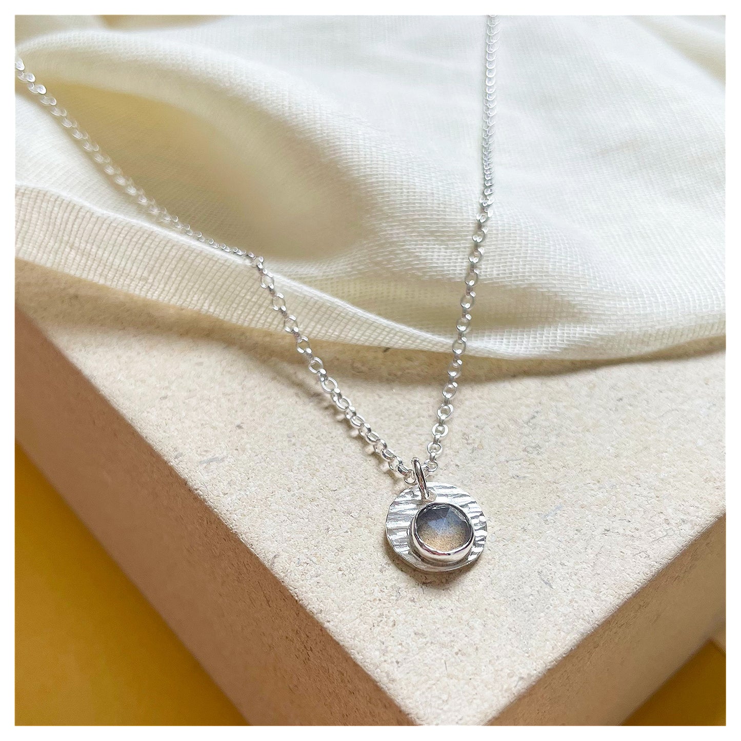 Sterling Silver and Grey Moonstone Hammered Disc Pendant.