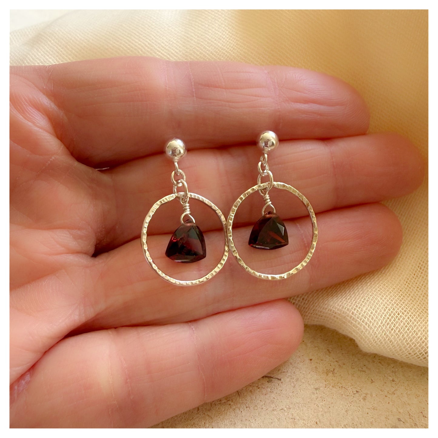 Sterling Silver Hammered Circle and Garnet Drop earrings.