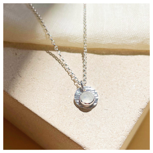 Sterling Silver and White Opal Hammered Disc Pendant.