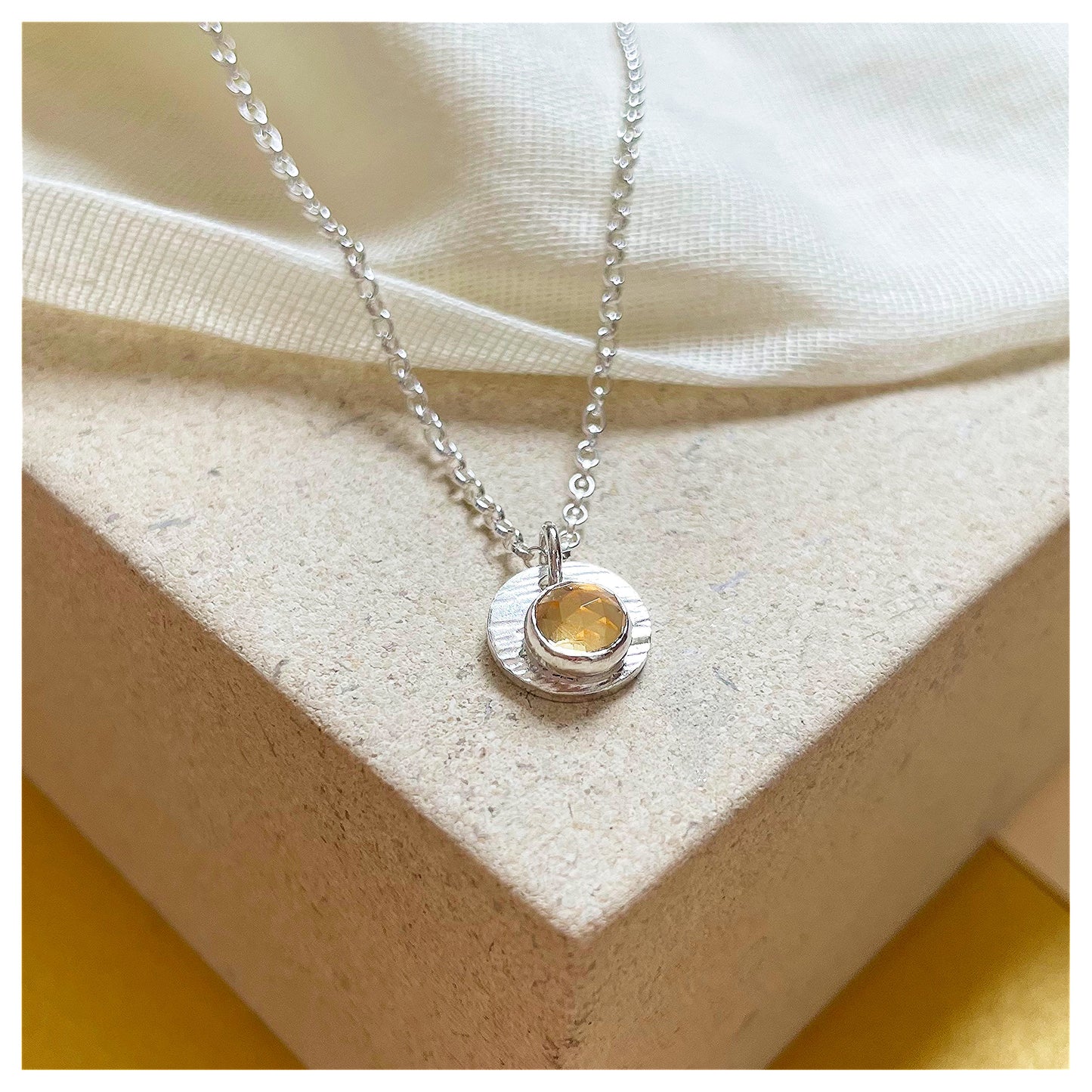Sterling Silver and Citrine Hammered Disc Pendant.