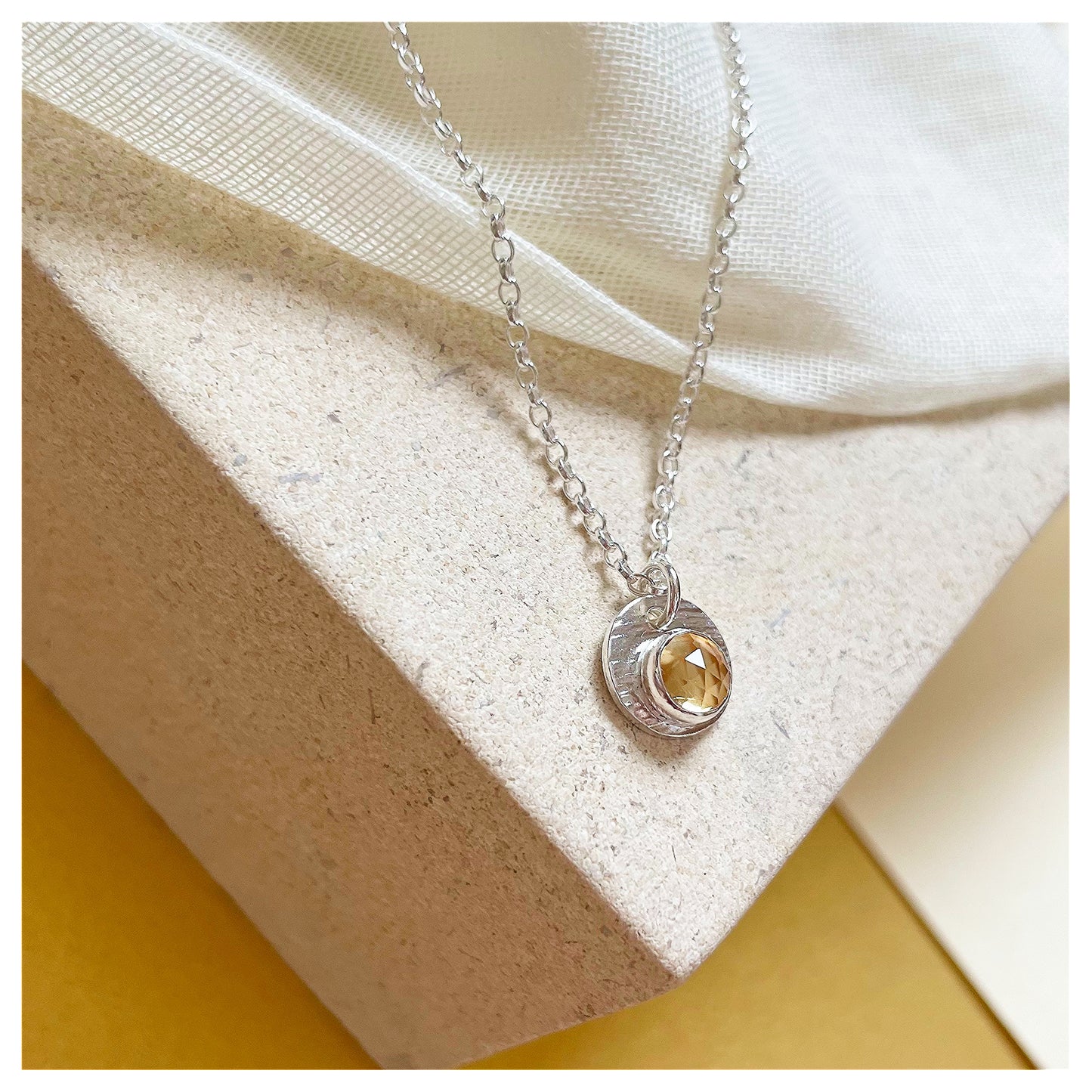 Sterling Silver and Citrine Hammered Disc Pendant.