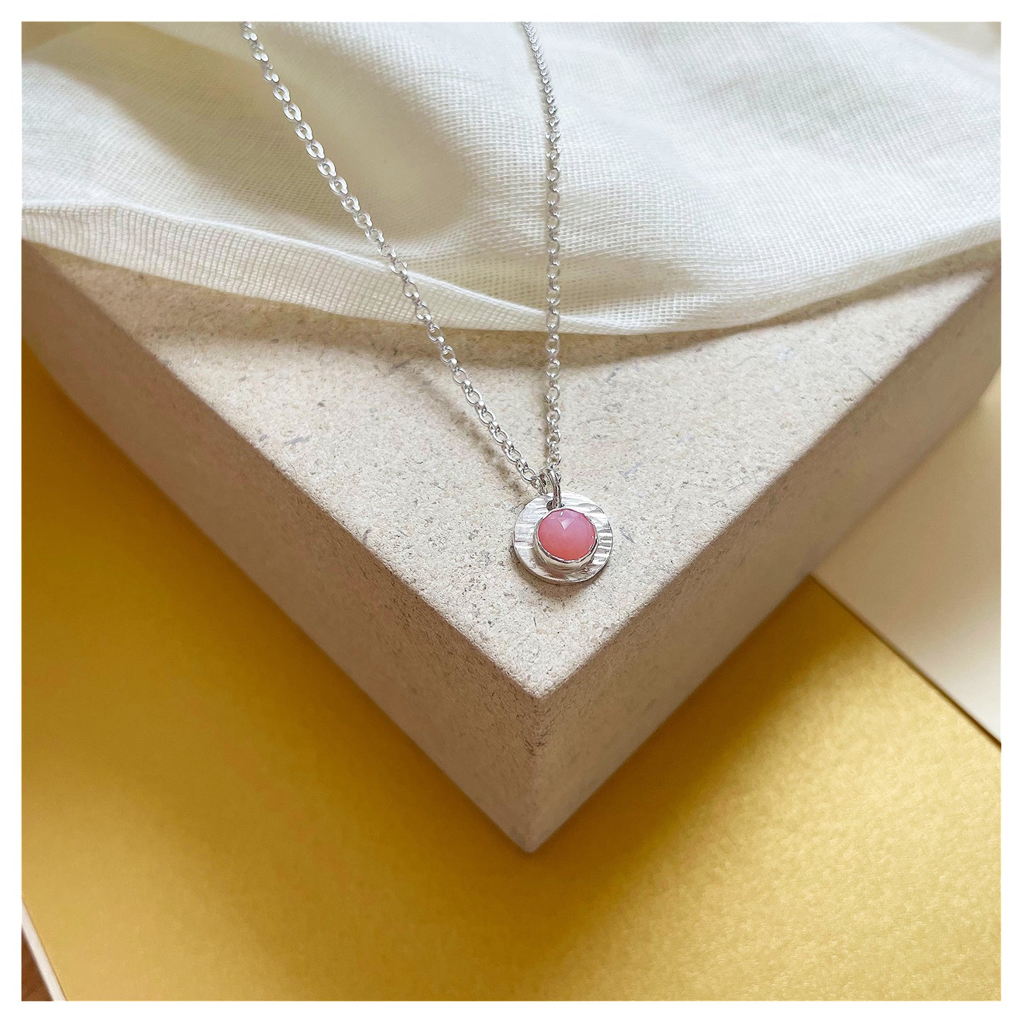 Sterling Silver and Pink Opal Hammered Disc Pendant.