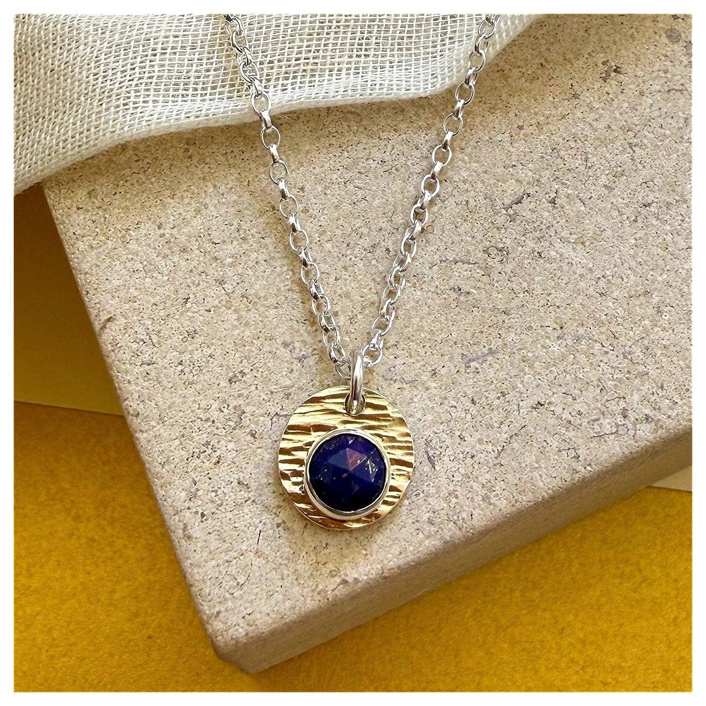 9ct Yellow Gold, Sterling Silver and Lapis Lazuli Hammered Disc Pendant.