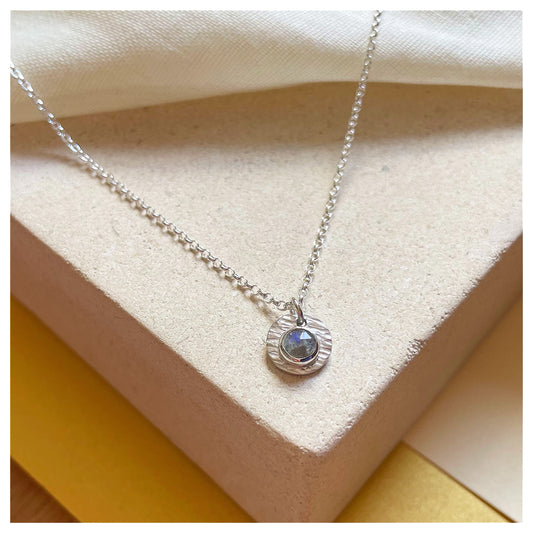 Sterling Silver and Labradorite Hammered Disc Pendant.