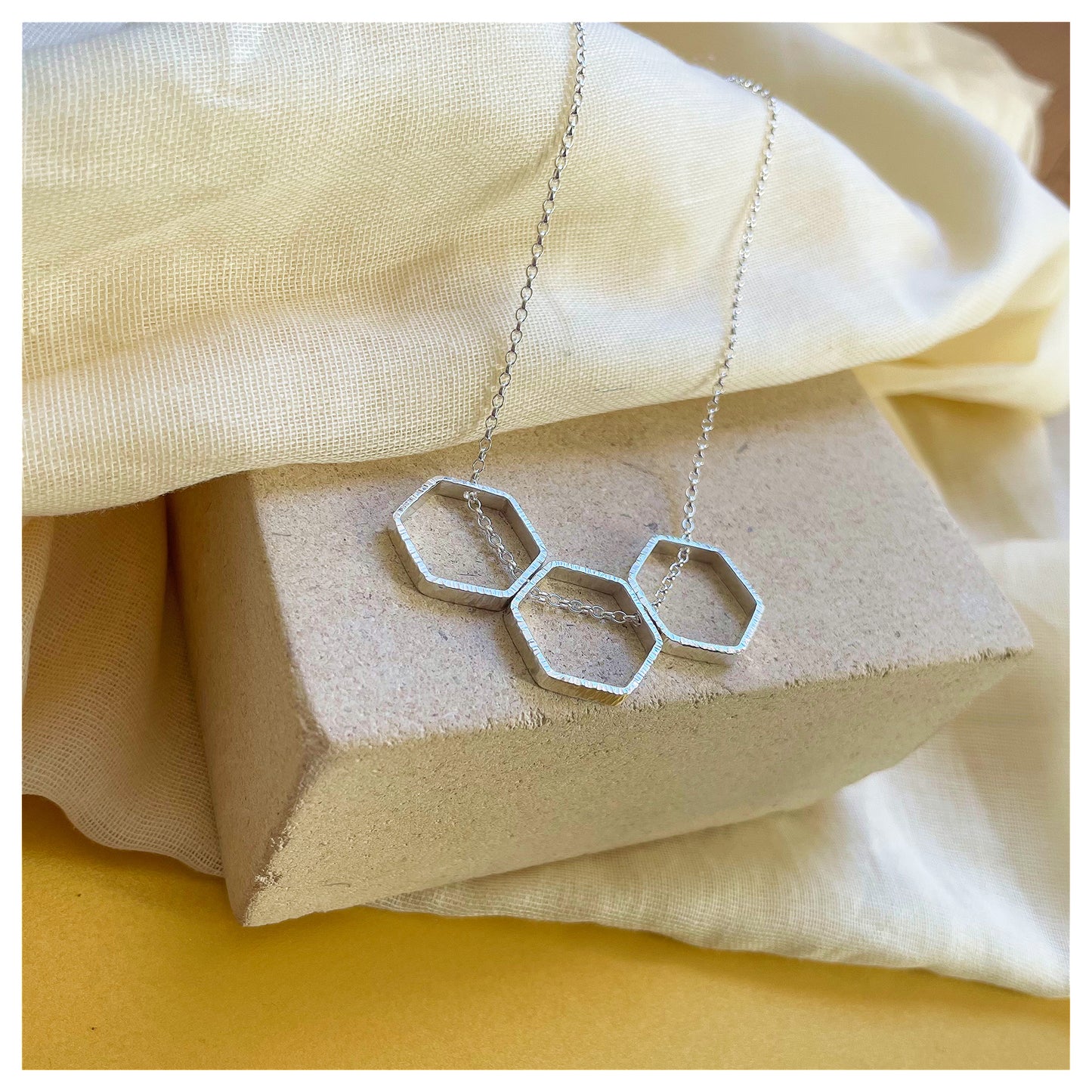 Sterling Silver Textured Triple Hexagon Necklace.