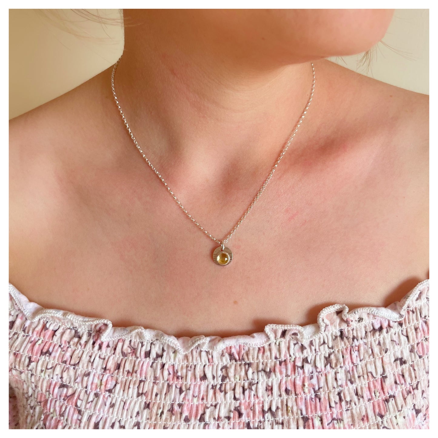 Sterling Silver and Citrine Hammered Disc Pendant.