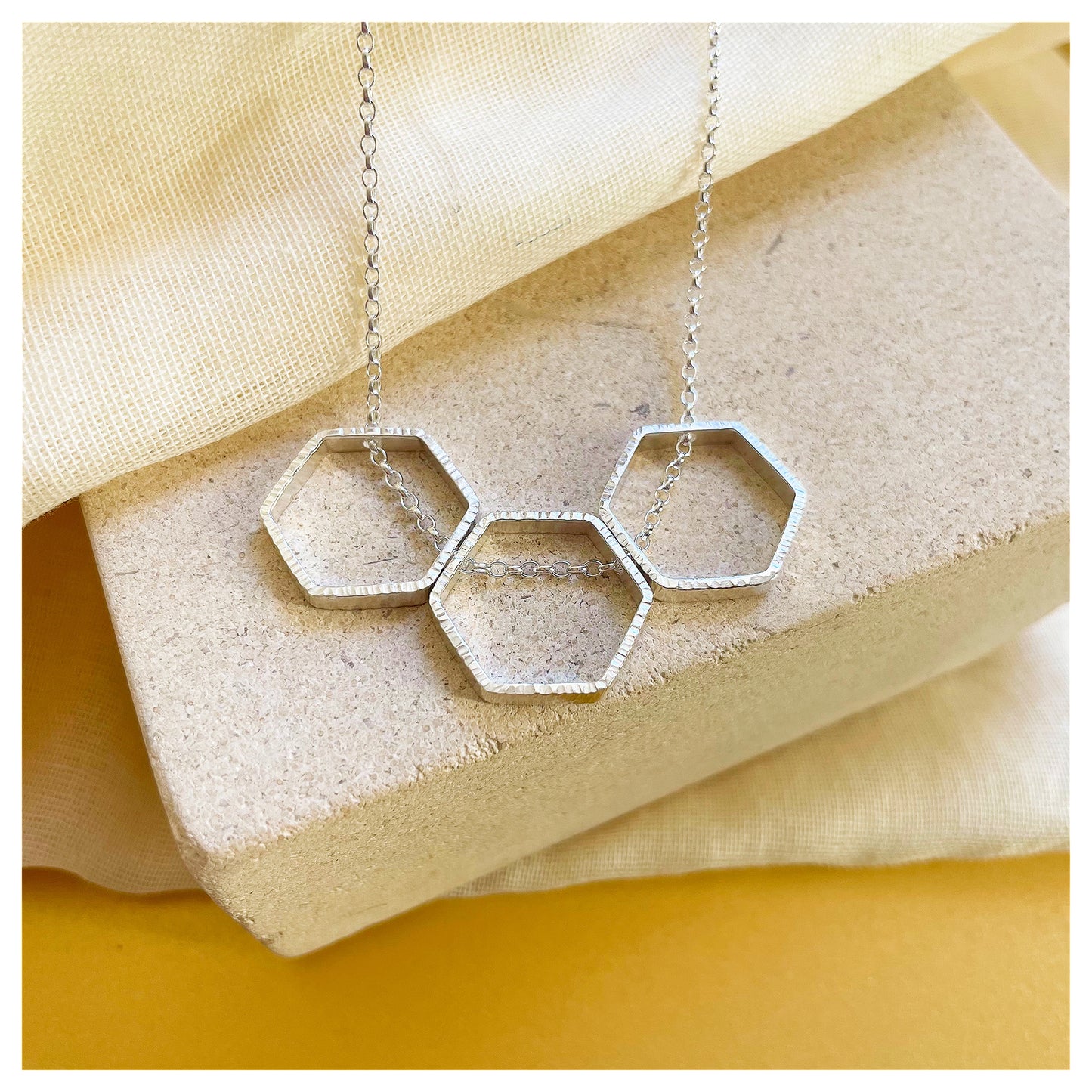 Sterling Silver Textured Triple Hexagon Necklace.