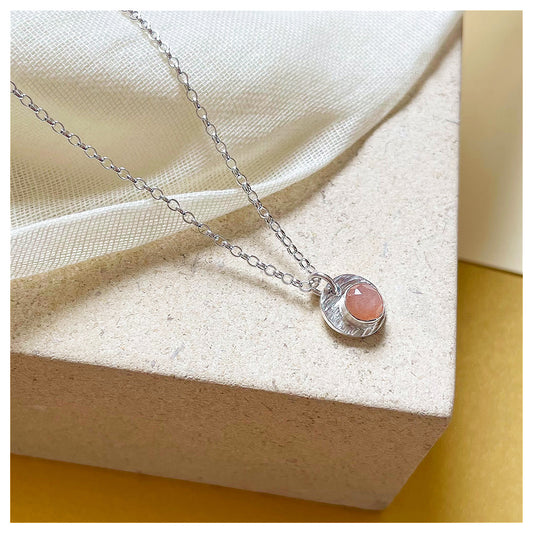 Sterling Silver and Peach Moonstone Hammered Disc Pendant.