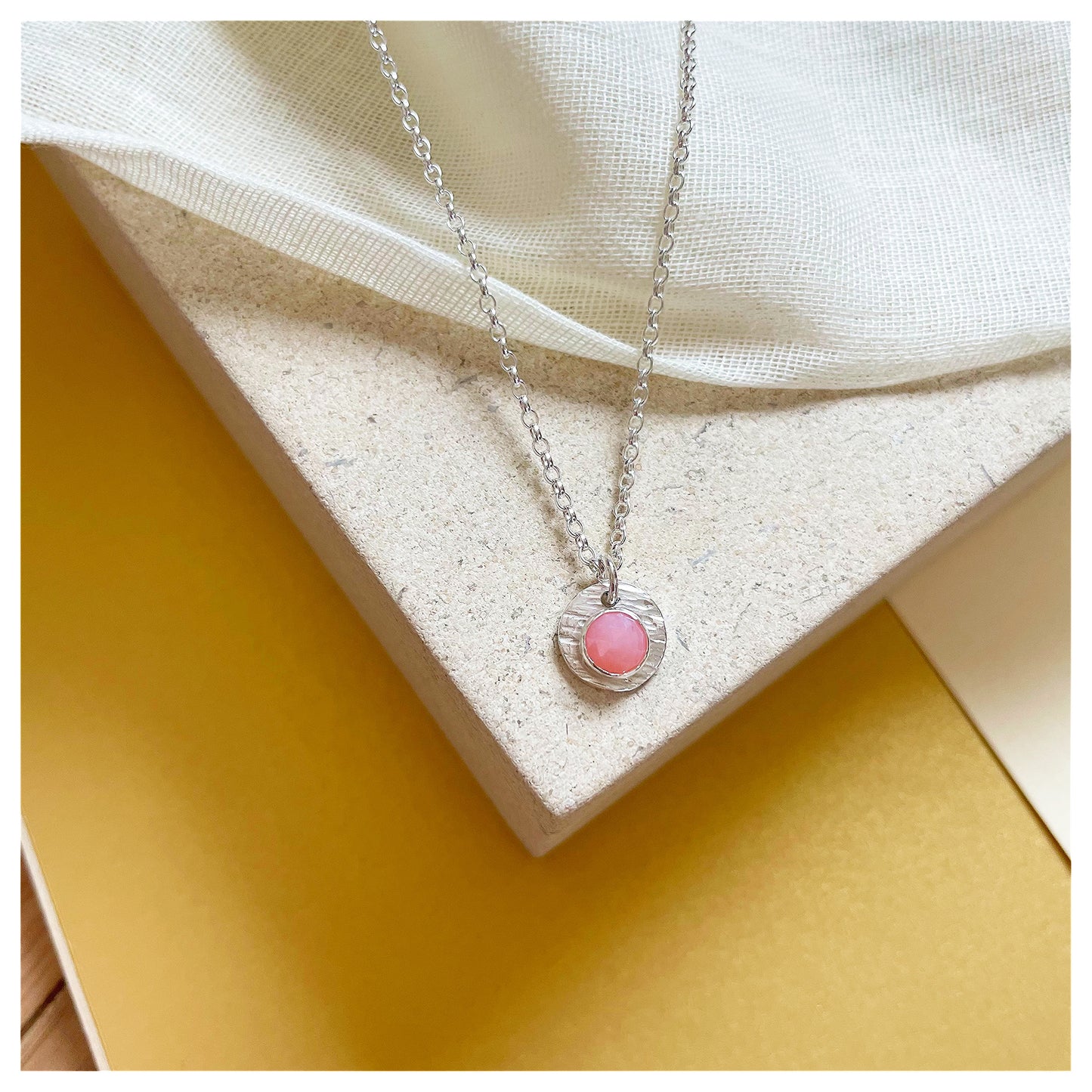 Sterling Silver and Pink Opal Hammered Disc Pendant.