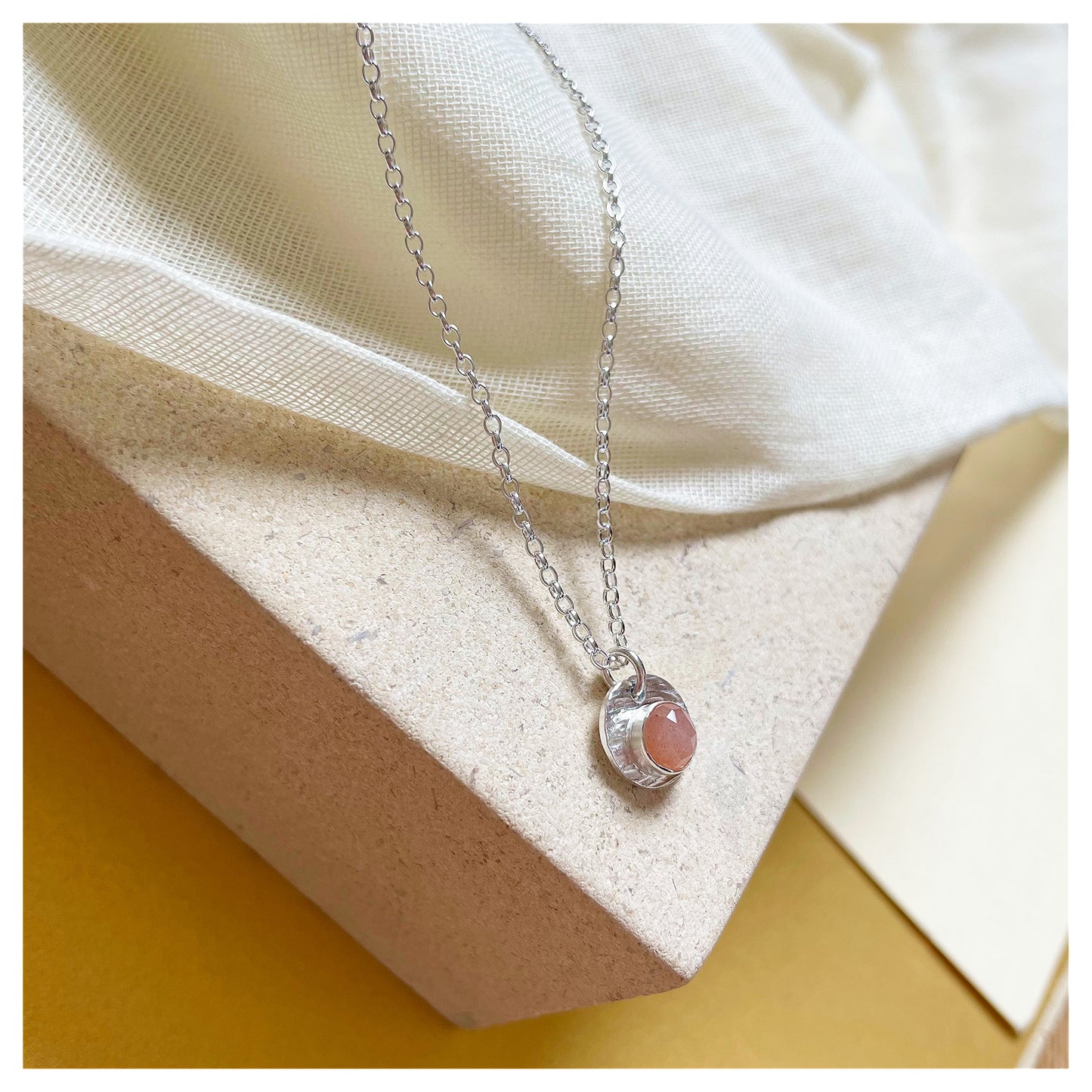 Sterling Silver and Peach Moonstone Hammered Disc Pendant.