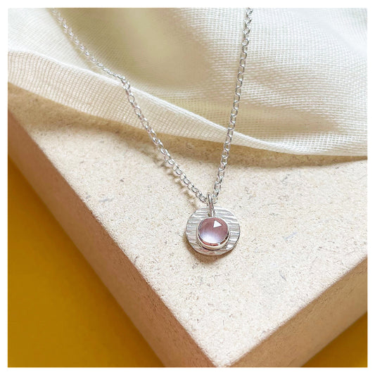 Sterling Silver and Rose Quartz Hammered Disc Pendant.