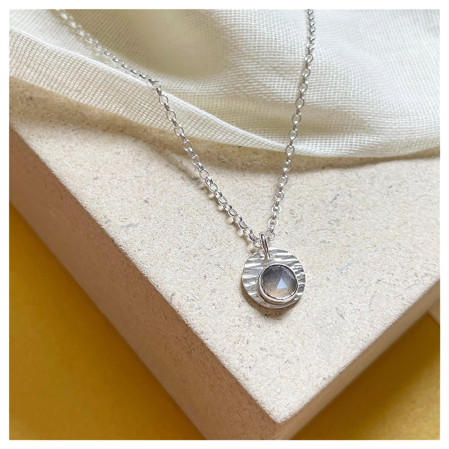 Sterling Silver and Grey Moonstone Hammered Disc Pendant.