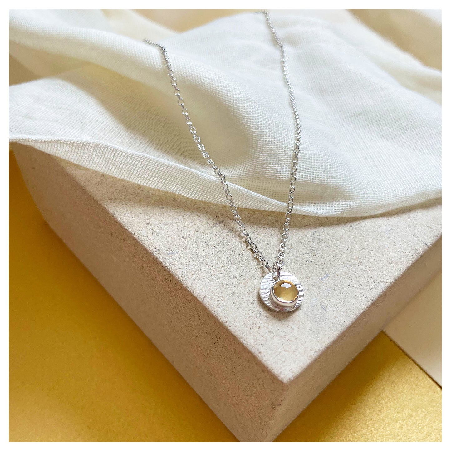 Sterling Silver and Citrine Hammered Disc Pendant.