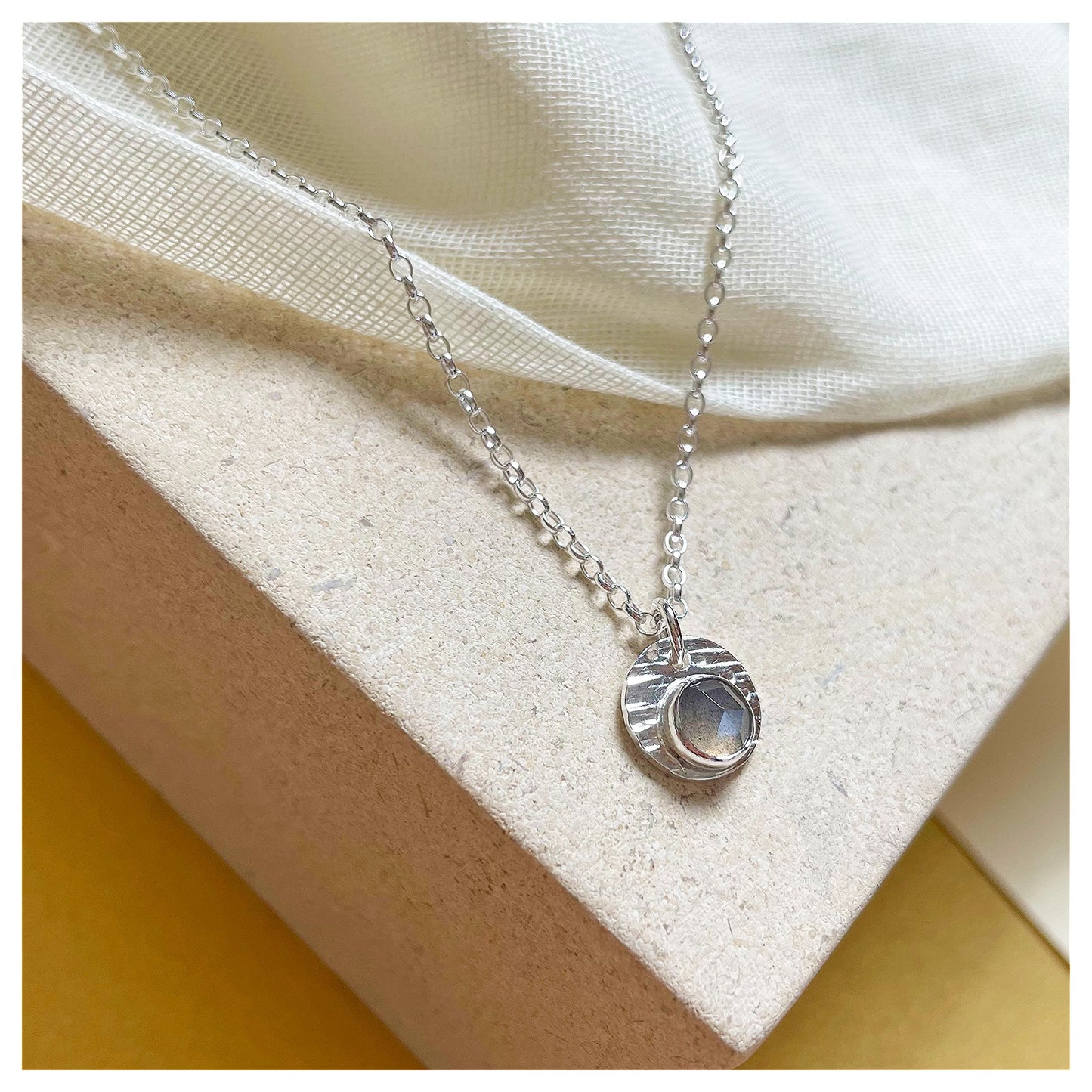 Sterling Silver and Grey Moonstone Hammered Disc Pendant.