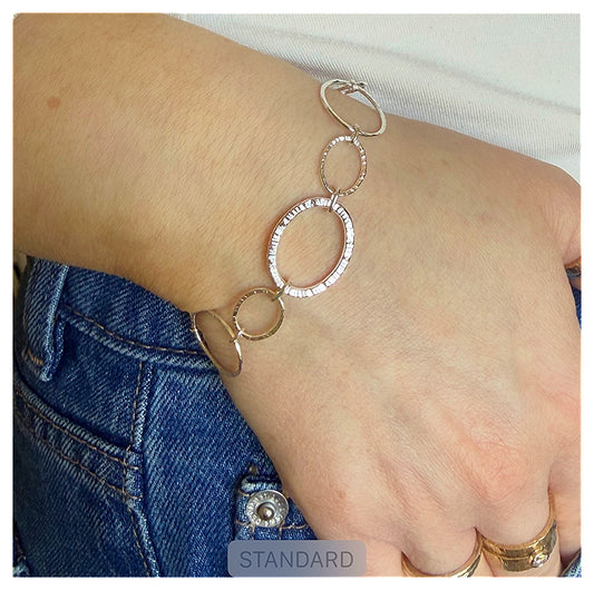 Sterling Silver Hammered Oval Link Chain Bracelet with large Hammered centre link .