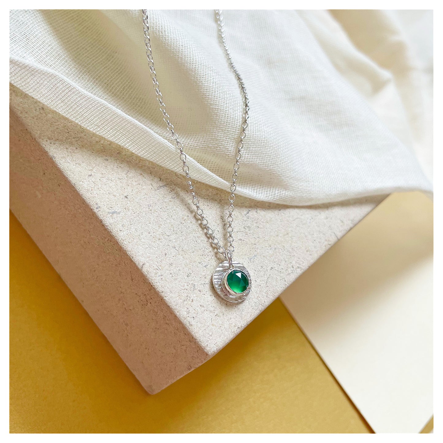 Sterling Silver and Green Onyx Hammered Disc Pendant.